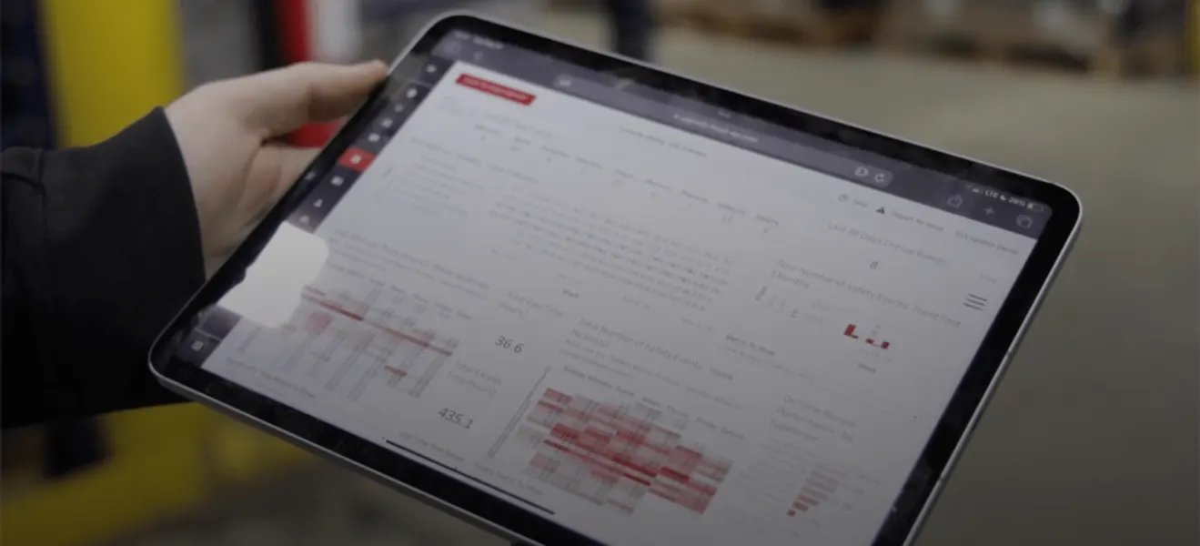 OneTrack on a tablet, held in a warehouse